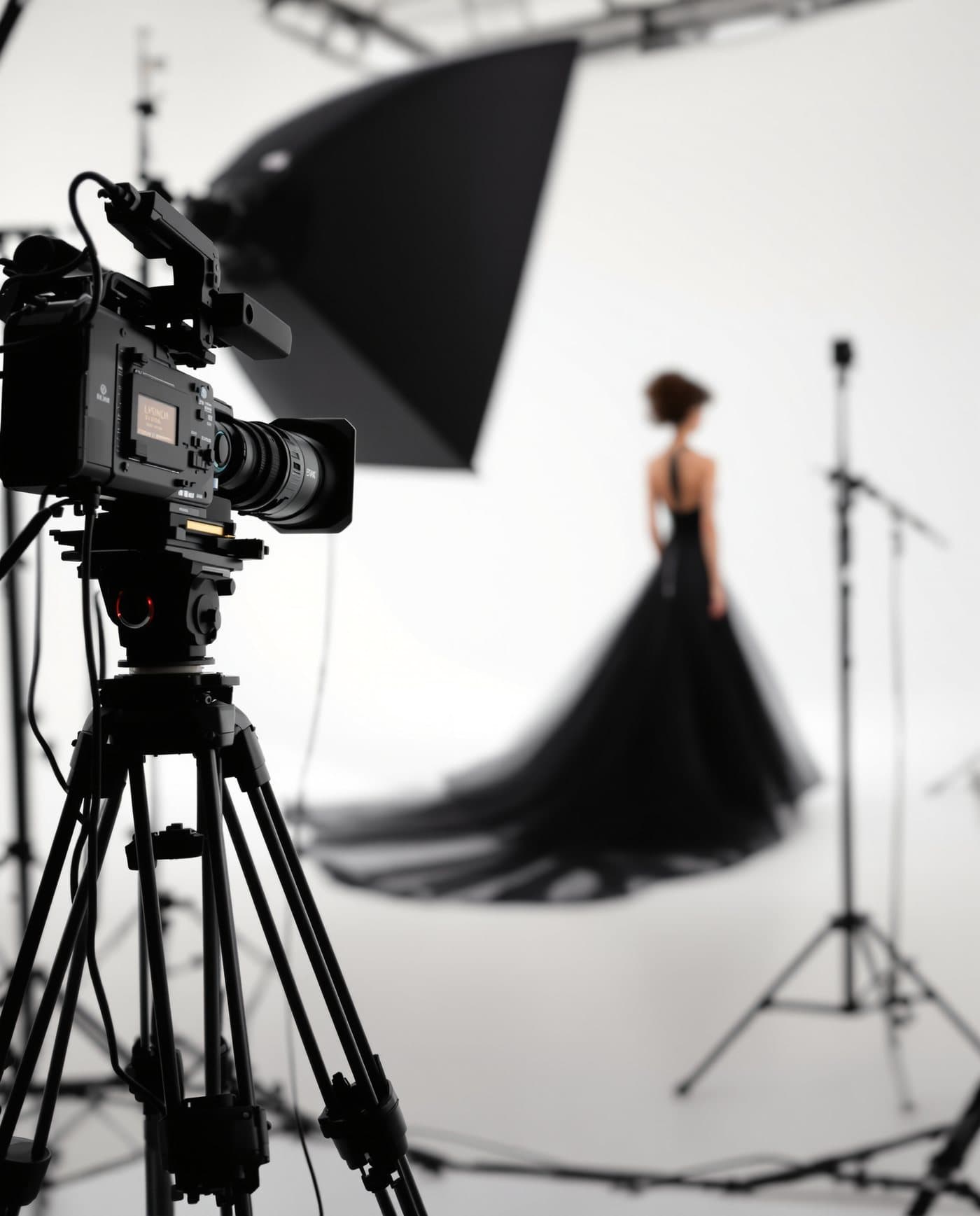A luxury fashion campaign shoot in a white studio